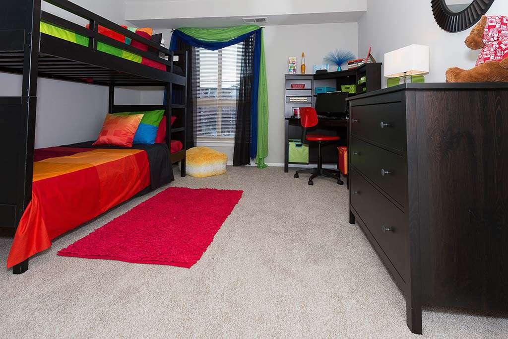Fully furnished bedroom with bunk beds at Joshua House apartments for rent in Philadelphia, PA