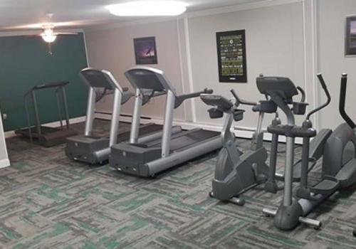 A gym with exercise equipment at Bromley House apartments for rent