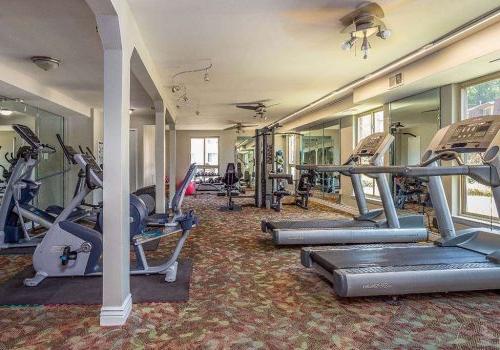 Fitness center with exercise equipment at Joshua House apartments for rent in Philadelphia, PA